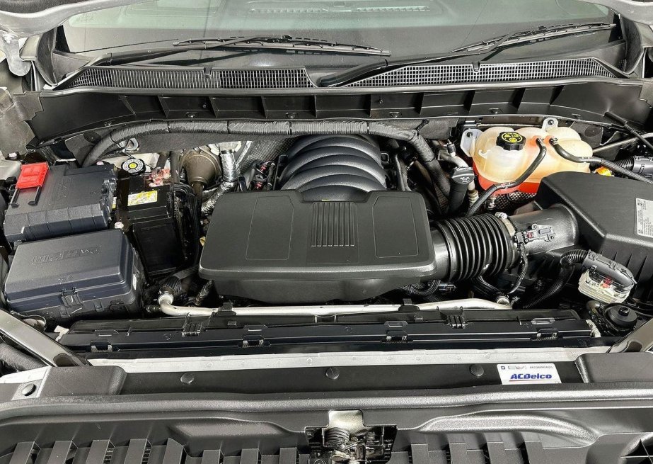 Engine bay of a full-size American pickup during a logbook service